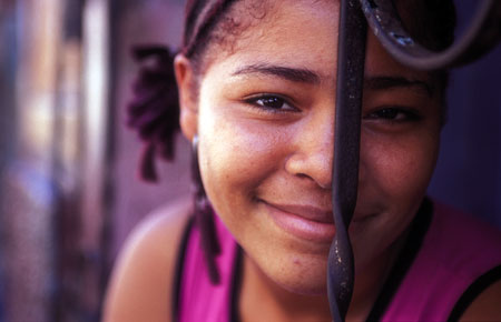 Local Girl Rachelle Agrees to Pose Among the Iron Railings Outside her Home in Casco Viejo